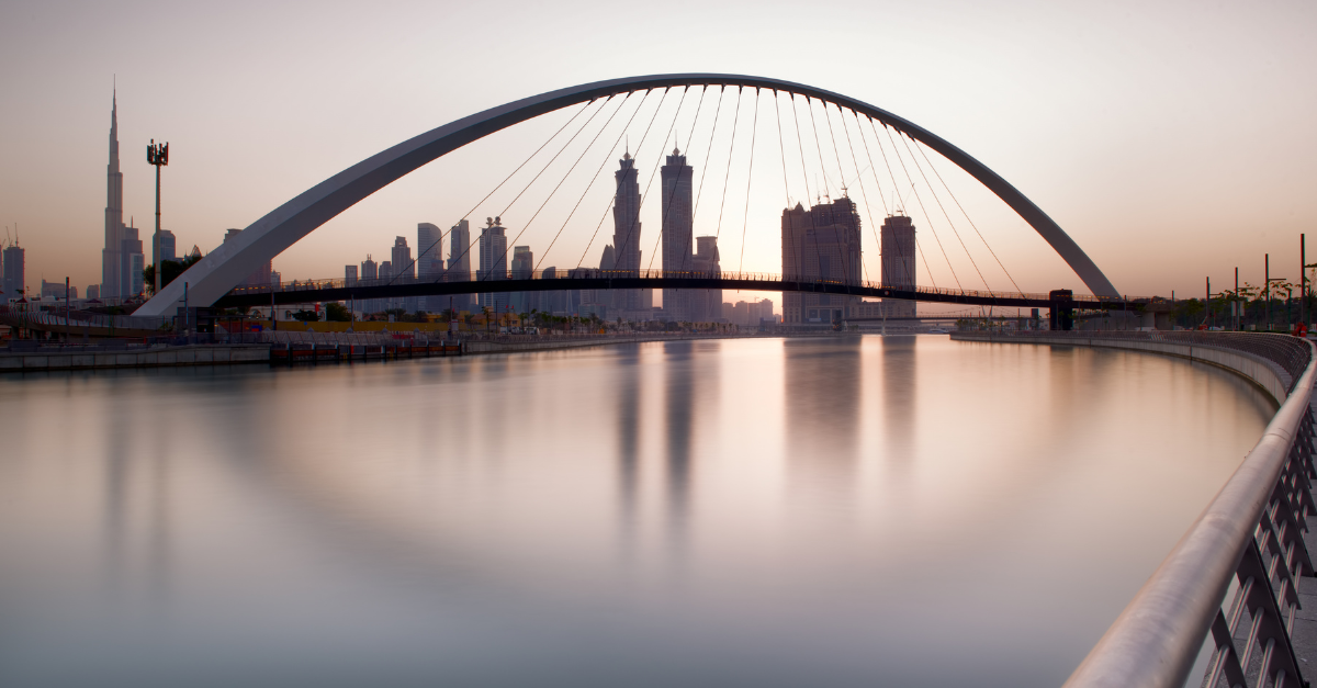 Dubai skyline at dawn seen through the Tolerance Bridge