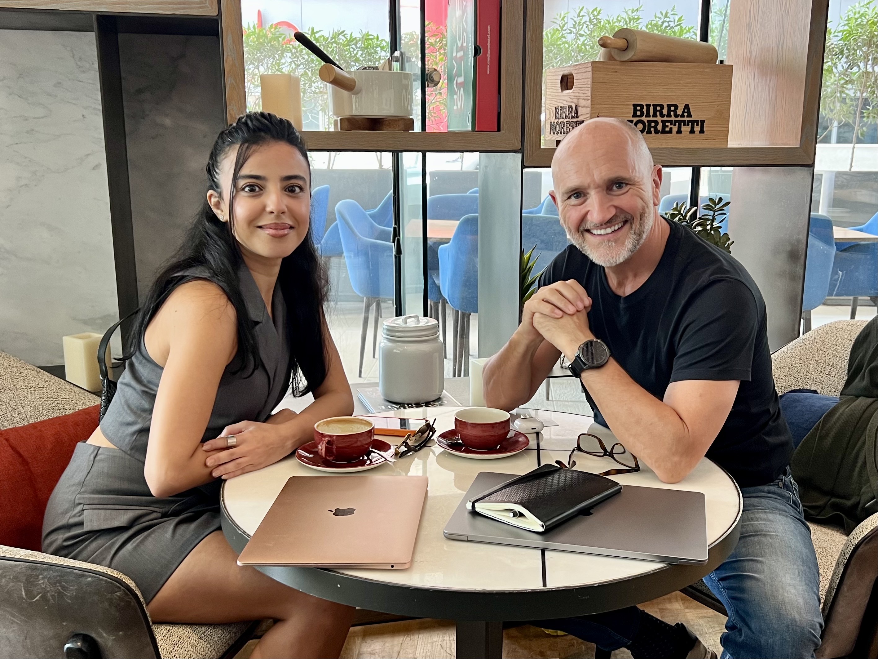Coach David Singleton in an executive coaching session with a client over coffee